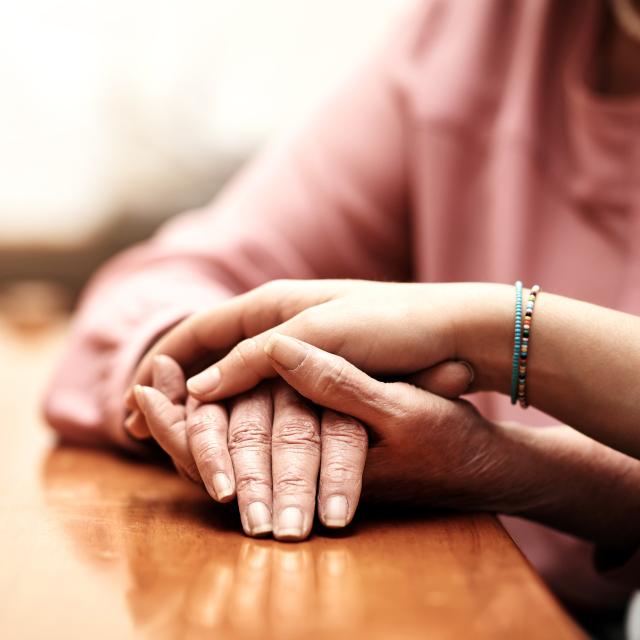 Two people holding hands.