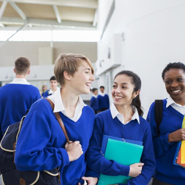 Teenagers laughing at school
