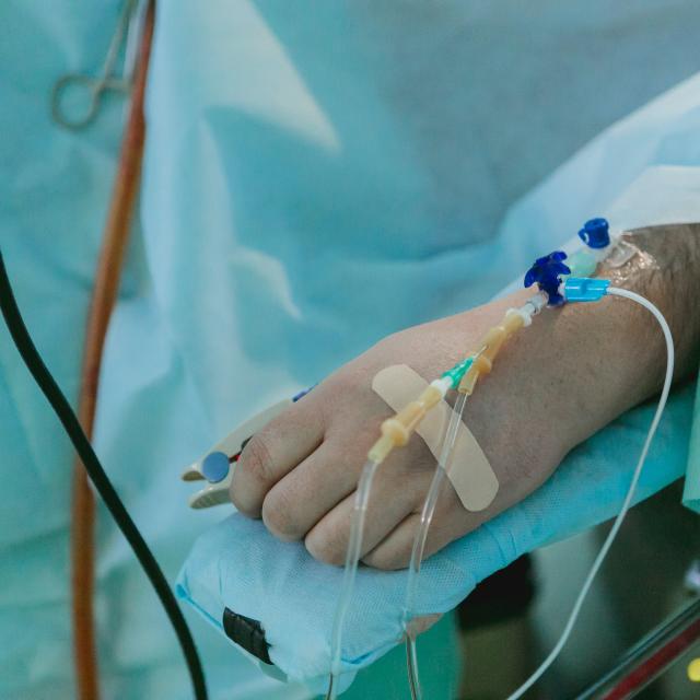 Person lying on hospital bed