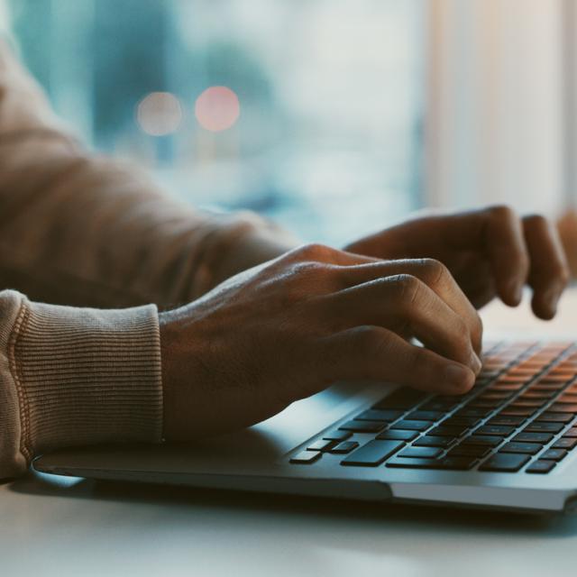 Women sitting at laptop in home