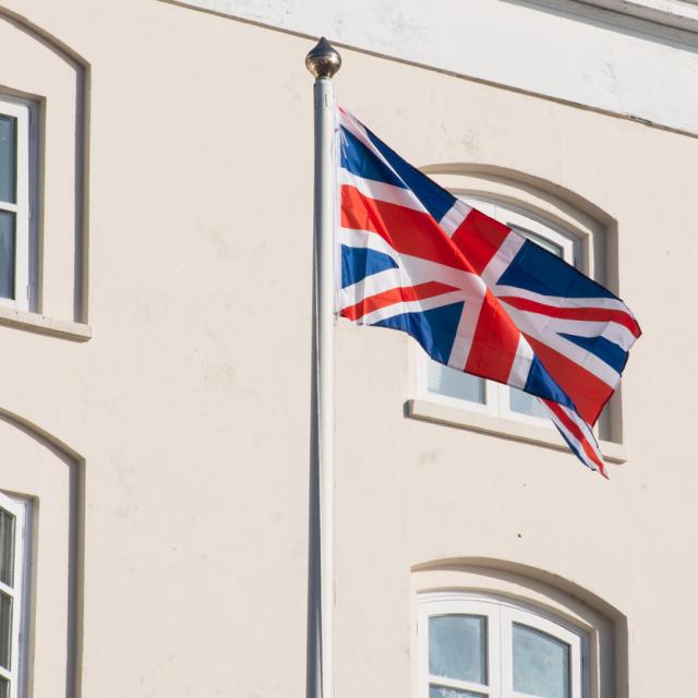 Union flag in front of a building