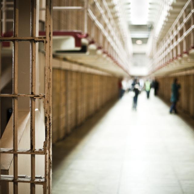 Corridor of a prison with cells.