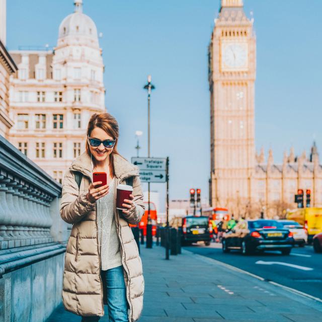 Female scrolling her phone in Westminster