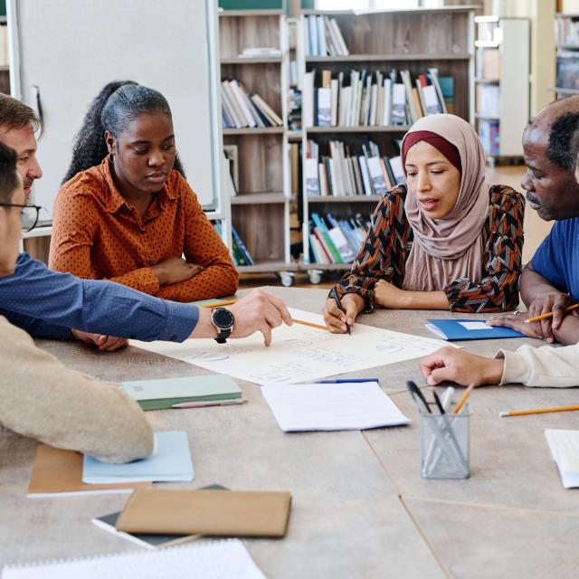 Group of colleagues collaborating around a table