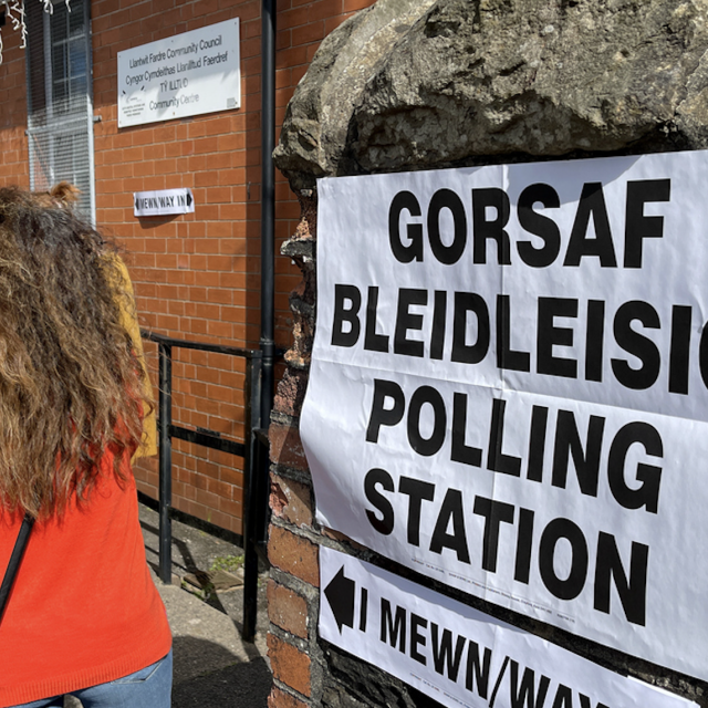 Queue of people waiting to enter a polling station