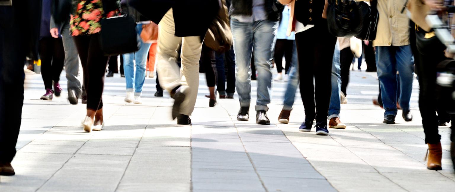 Pedestrians on tiled pavement with long exposure
