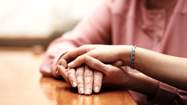Two people holding hands.