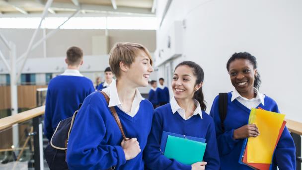 Teenagers laughing at school