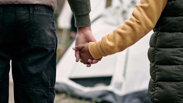 Parent and child holding hands