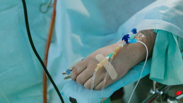Person lying on hospital bed