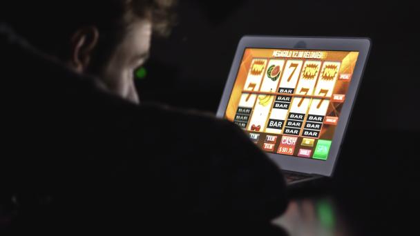 Man staring at online fruit machine