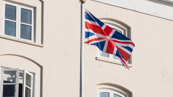 Union flag in front of a building