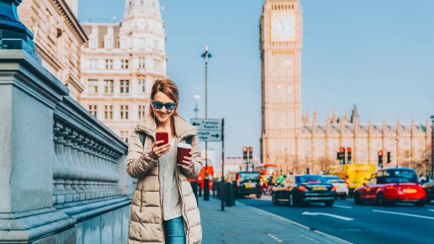 Female scrolling her phone in Westminster