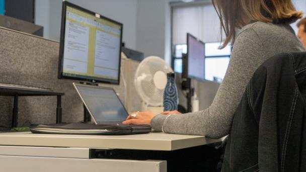 Person at laptop working on survey questions