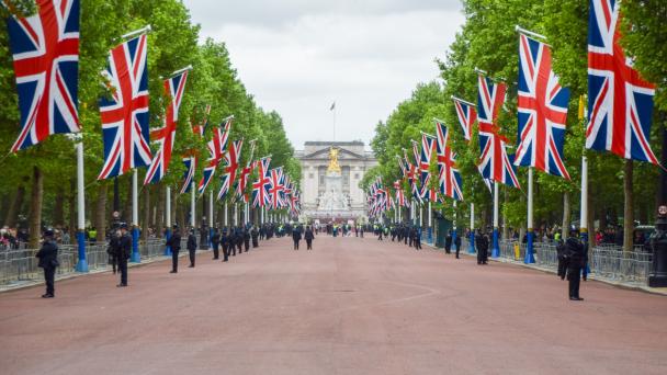 The Mall, London UK. Union jacks line the side of The Mall leading up to Buckingham Palace.