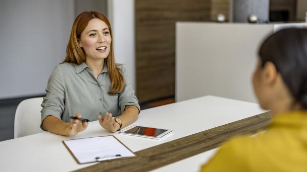 A woman asking someone questions