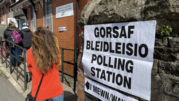 Queue of people waiting to enter a polling station