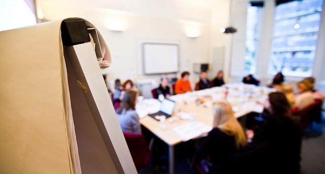 Group of people sitting around a table at a training course